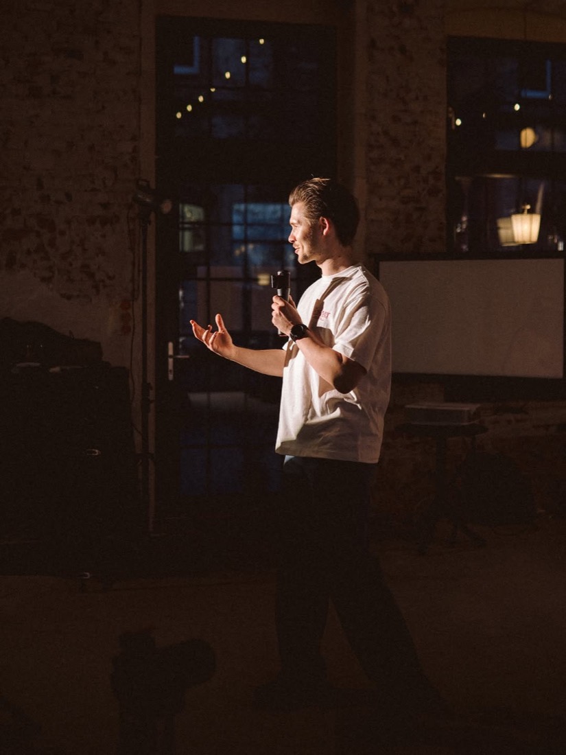 Matthew Kosobucki speaking on stage